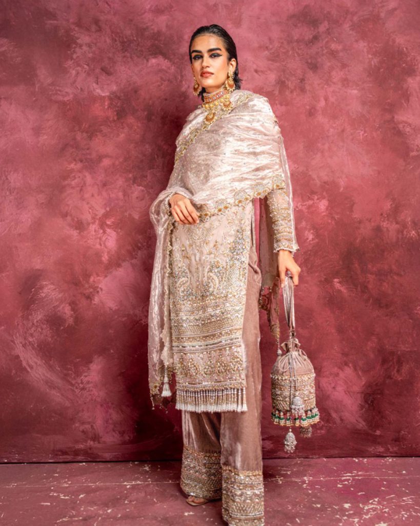 Pastel beige embroidered long kurti set with matching monochrome straight fit pants.