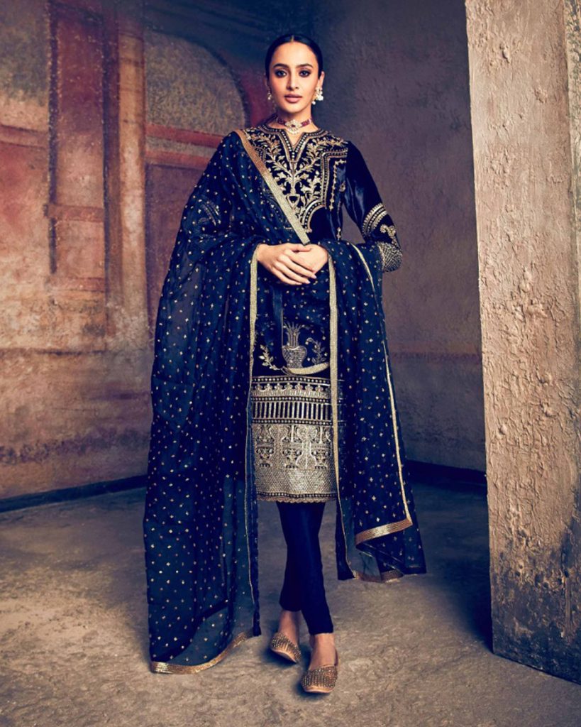 Navy blue embroidered formal kurti set paired with a traditional gathered churidar