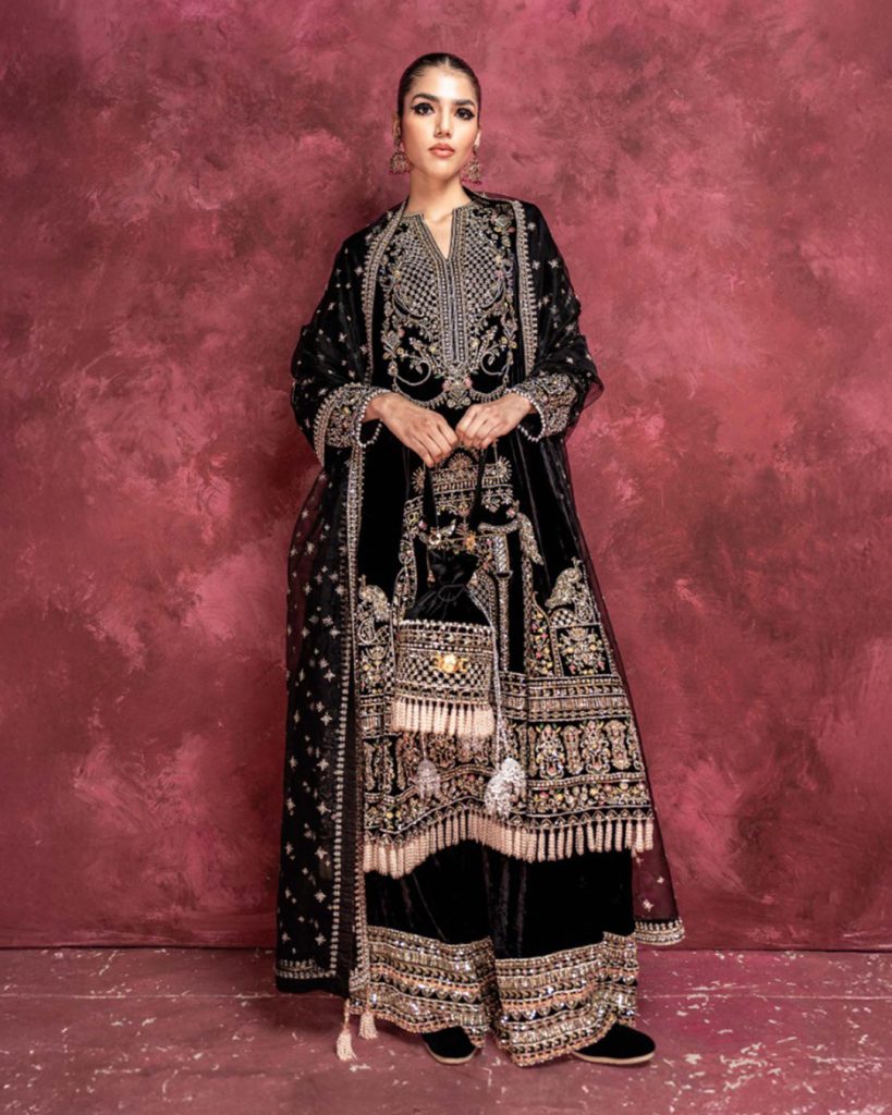 Dark green embroidered long kurti styled with wide-leg velvet palazzo pants